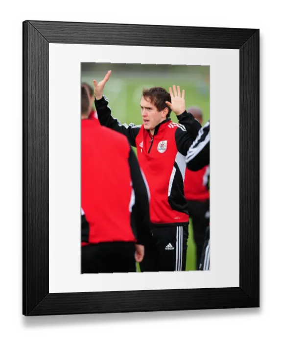 Framed Print : Neil Kilkenny in Training: Focused Moment at Bristol City Football Club