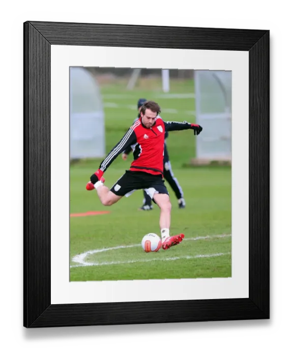Framed Print : Brett Pitman in Training: Focused Moment at Bristol City Football Club