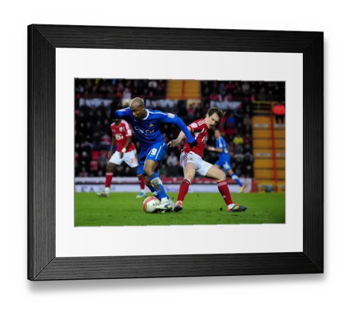 Framed Print : Championship Showdown: Neil Kilkenny vs El-Hadji Diouf - A Fight for Possession, Bristol City vs Doncaster Rovers, 21st January 2012 Framed Print : Championship Showdown: Neil Kilkenny vs El-Hadji Diouf - A Fight for Possession, Bristol City vs Doncaster Rovers, 21st January 2012