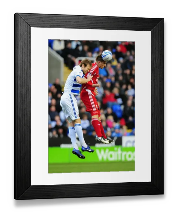 Framed Print : Chris Wood vs. Kaspars Gorkss: Battle for the High Ball in Reading v Bristol City Championship Match, 28 / 01 / 2012