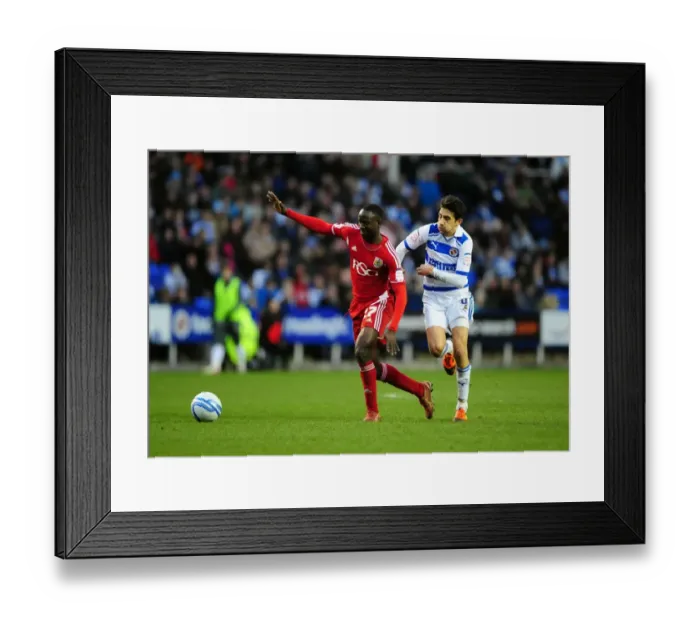 Framed Print : Albert Adomah Fouled by Jem Karacan in Reading vs. Bristol City Championship Match, 2012