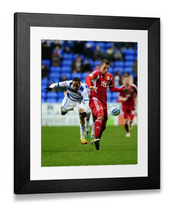 Framed Print : Chris Wood vs Shaun Cummings: Intense Battle for the Ball in Reading vs Bristol City Championship Clash - 28 / 01 / 2012