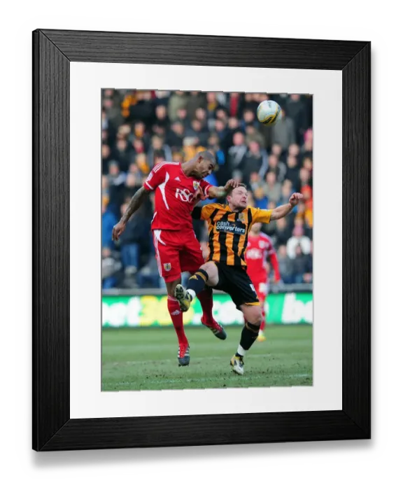 Framed Print : Battling for Championship Supremacy: Marvin Elliott vs. Paul McKenna - Hull City vs. Bristol City, 11 / 02 / 2012 Framed Print : Battling for Championship Supremacy: Marvin Elliott vs. Paul McKenna - Hull City vs. Bristol City, 11 / 02 / 2012