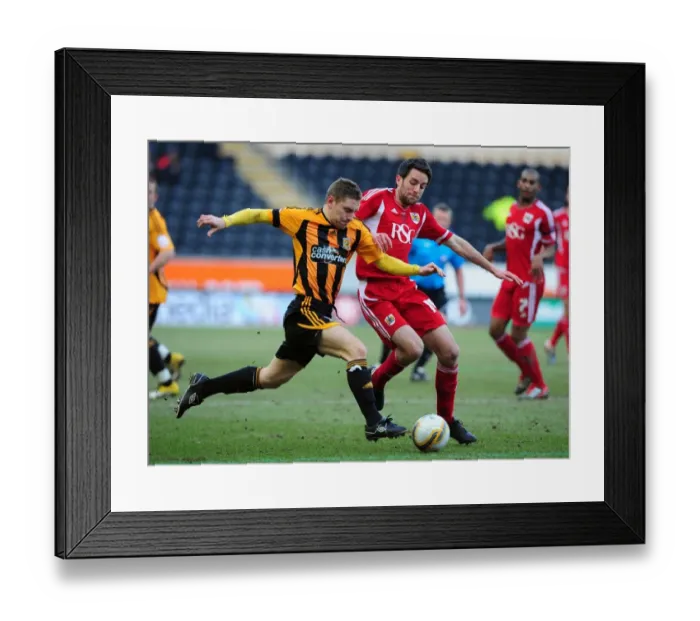 Framed Print : Battling for Supremacy: Cole Skuse vs. Andy Dawson in Hull City vs. Bristol City Championship Clash - 11 / 02 / 2012