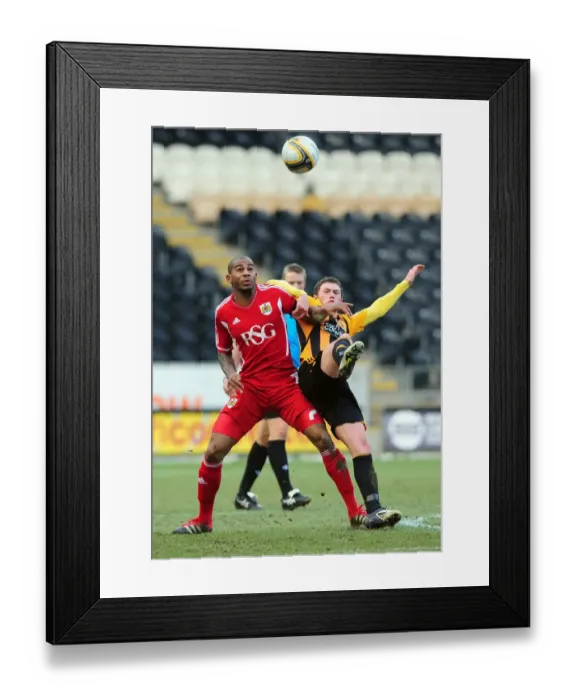 Framed Print : Battling Midfielders: Marvin Elliott vs. Corry Evans in Hull City vs. Bristol City Championship Clash - 11 / 02 / 2012