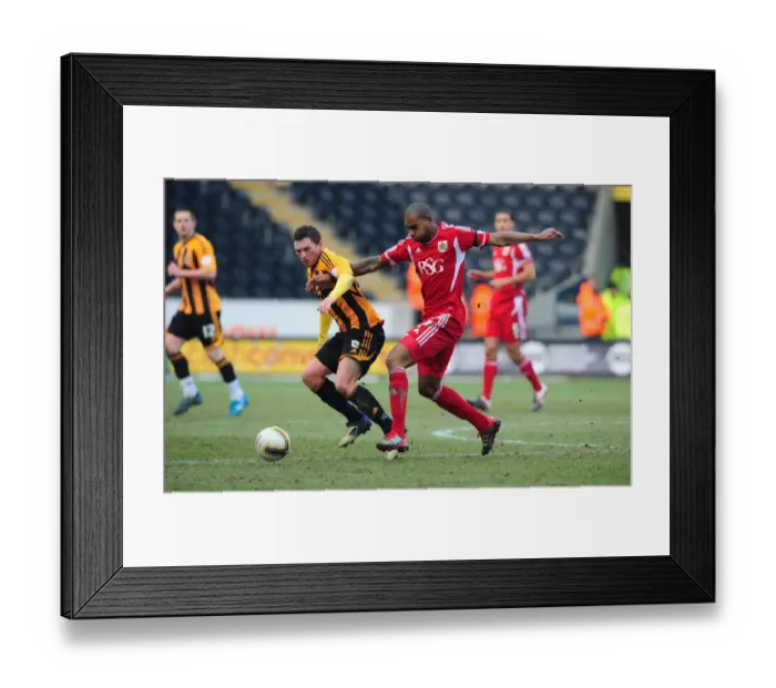 Framed Print : Championship Showdown: Marvin Elliott vs. Corry Evans - Intense Midfield Battle at Hull City's KC Stadium, February 11, 2012