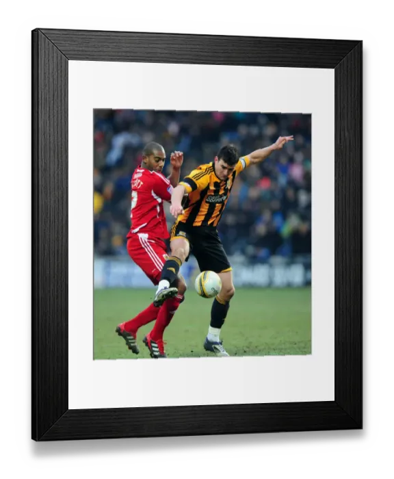 Framed Print : Championship Showdown: Marvin Elliott vs. Jack Hobbs - A Battle for Supremacy in Hull City vs. Bristol City (November 2012)