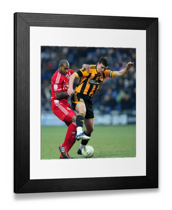 Framed Print : Battling for the Ball: Marvin Elliott vs. Jack Hobbs in Hull City vs. Bristol City Championship Clash - 11 / 02 / 2012 Framed Print : Battling for the Ball: Marvin Elliott vs. Jack Hobbs in Hull City vs. Bristol City Championship Clash - 11 / 02 / 2012