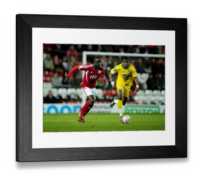 Framed Print : Adomah vs Zaha: Intense Battle Between Bristol City's Albert Adomah and Crystal Palace's Wilfried Zaha in 2012 Championship Clash