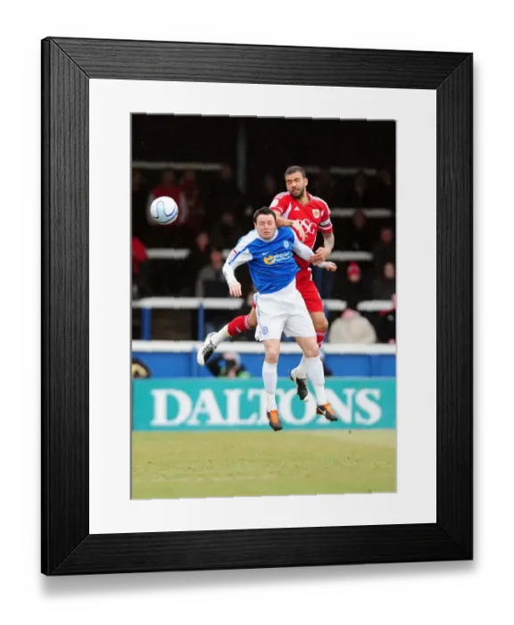 Framed Print : Battling for Supremacy: Liam Fontaine vs. Lee Tomlin in Peterborough United vs. Bristol City Football Match