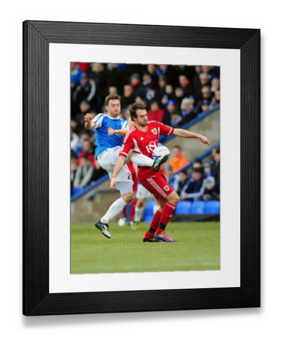 Framed Print : Battling for Supremacy: Brett Pitman vs. Lee Frecklington in Peterborough United vs. Bristol City Football Match