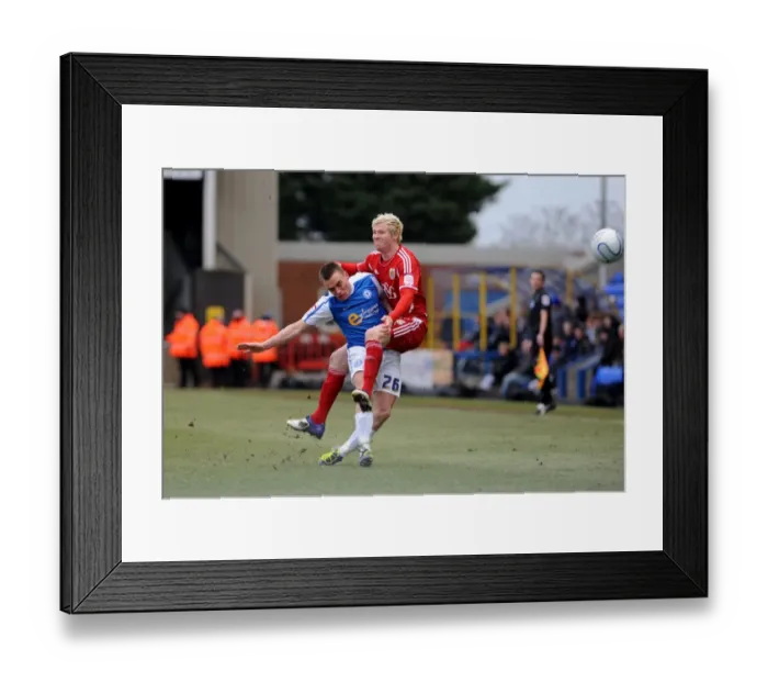 Framed Print : Battling for Supremacy: McGivern vs. Taylor in Peterborough United vs. Bristol City Football Match, 2012