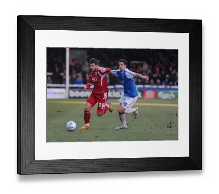 Framed Print : Battling for Supremacy: Foster vs. Boyd in Peterborough United vs. Bristol City Football Match, 2012