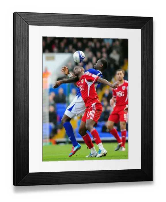 Framed Print : Bristol City's Kalifa Cisse vs. Jay Emmanuel-Thomas: A Battle for Supremacy at Portman Road, Ipswich (Ipswich Town vs. Bristol City, Football Match)