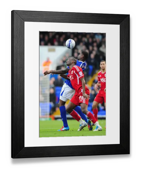 Framed Print : Battling for Supremacy: Cisse vs. Emmanuel-Thomas in Ipswich Town vs. Bristol City Football Match, 2012