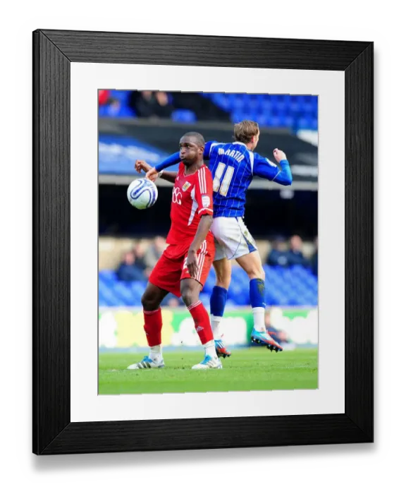 Framed Print : Bristol City's Kalifa Cisse vs. Ipswich Town's Lee Martin: Intense Battle for Ball Possession during Ipswich Town v Bristol City Football Match, Portman Road, England, 2012