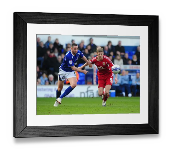 Framed Print : Battling for the Ball: Jon Stead vs. Damien Delaney, Ipswich Town vs. Bristol City Football Rivalry, March 2012