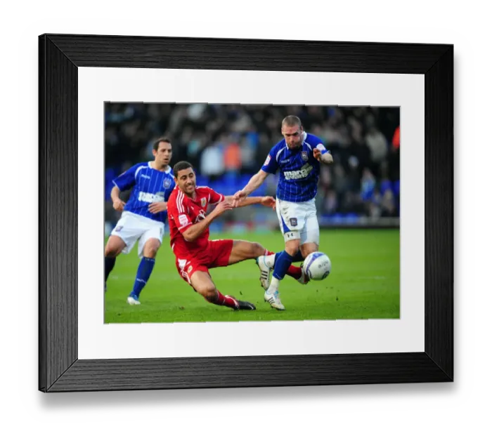 Framed Print : Battling for Supremacy: Nyatanga vs. Leadbitter in Ipswich Town vs. Bristol City Football Match, 2012 Framed Print : Battling for Supremacy: Nyatanga vs. Leadbitter in Ipswich Town vs. Bristol City Football Match, 2012