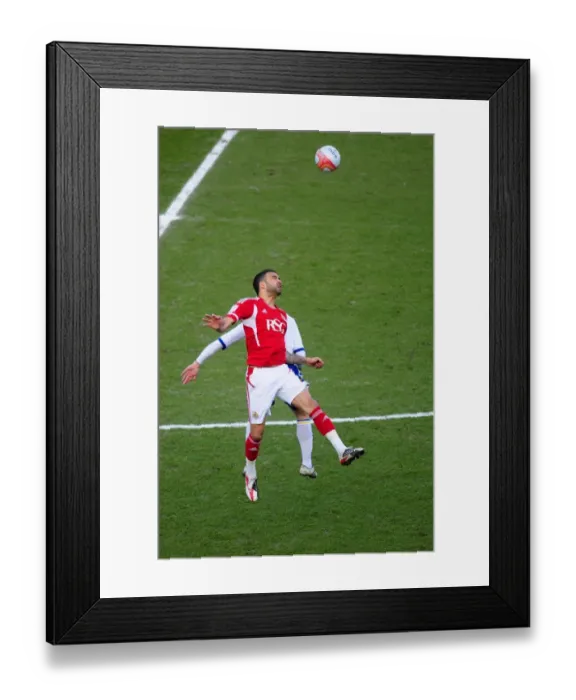Framed Print : Bristol City vs. Cardiff City: Liam Fontaine vs. Kenny Miller in Intense Aerial Battle