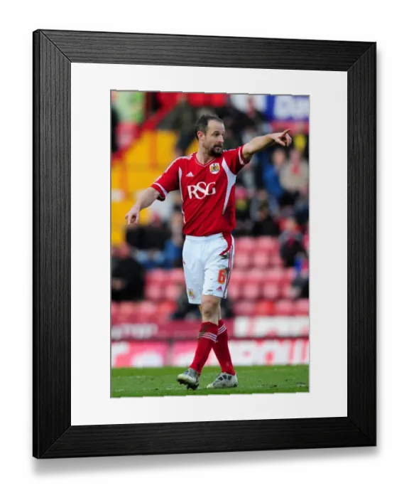 Framed Print : Louis Carey Leads the Charge: Bristol City vs. Cardiff City at Ashton Gate Stadium, March 10, 2012