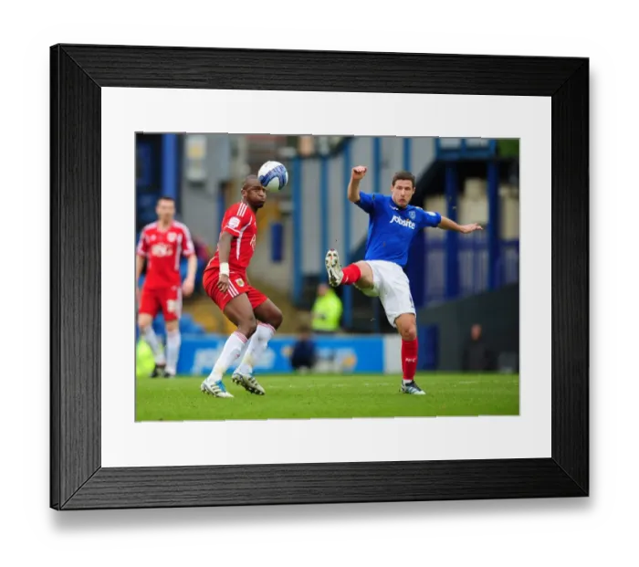 Framed Print : Bristol City's Kalifa Cisse Defies Gravity: Soaring Over Portsmouth's David Norris in a Memorable Football Moment