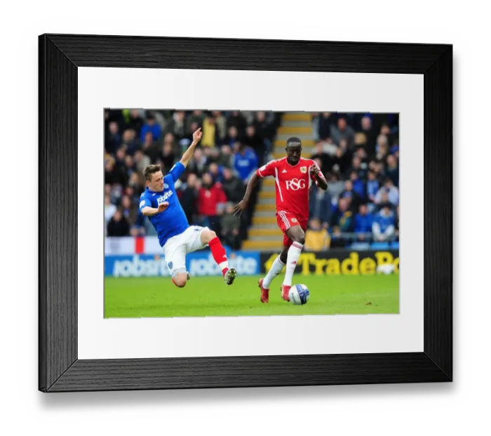 Framed Print : Adomah Eves Drop: Bristol City's Albert Adomah Skirts Past Scott Allan in Thrilling Portsmouth Clash Framed Print : Adomah Eves Drop: Bristol City's Albert Adomah Skirts Past Scott Allan in Thrilling Portsmouth Clash