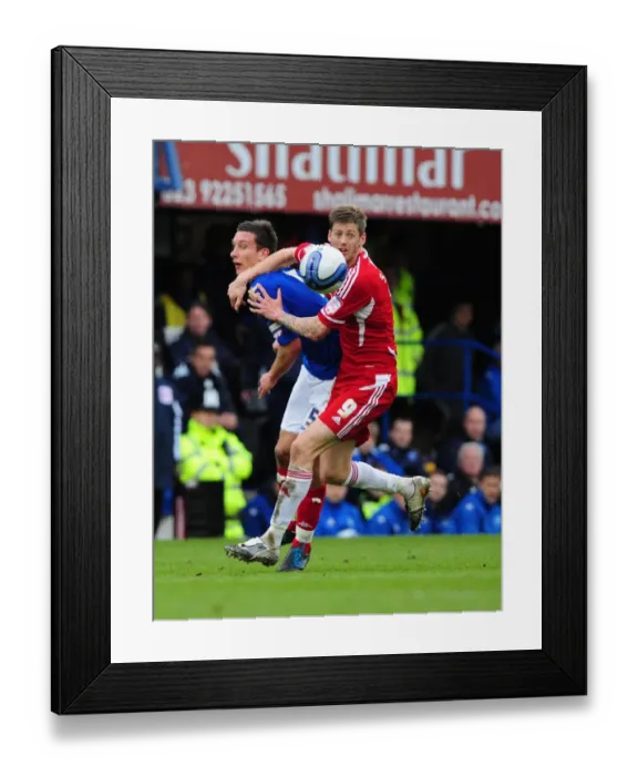 Framed Print : Battling for Supremacy: Jon Stead vs. Jason Pearce in Portsmouth vs. Bristol City Football Match, 2012