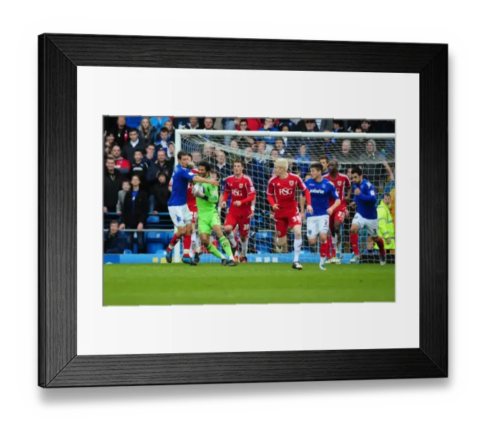 Framed Print : Portsmouth's Jason Pearce Fouls Bristol City's David James during Match Framed Print : Portsmouth's Jason Pearce Fouls Bristol City's David James during Match