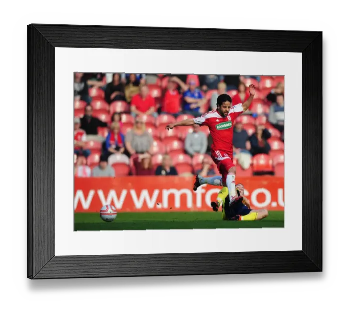Framed Print : Intense Rivalry: Hogan Ephraim vs. Merouane Zemmama - A Football Battle at Riverside Stadium