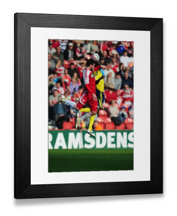 Framed Print : Middlesbrough's Matthew Bates vs. Albert Adomah of Bristol City - A Battle for the High Ball at Riverside Stadium, 2012 Framed Print : Middlesbrough's Matthew Bates vs. Albert Adomah of Bristol City - A Battle for the High Ball at Riverside Stadium, 2012