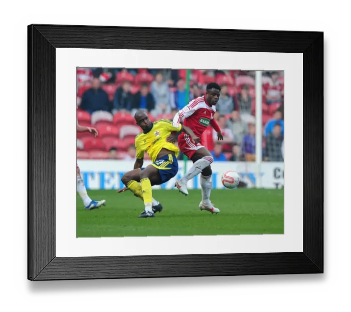 Framed Print : Football Rivalry: Cisse vs. Ogbeche at Riverside Stadium (2012) - Bristol City's Kalifa Cisse and Middlesbrough's Barthomew Ogbeche in a Tight Battle for the Ball Framed Print : Football Rivalry: Cisse vs. Ogbeche at Riverside Stadium (2012) - Bristol City's Kalifa Cisse and Middlesbrough's Barthomew Ogbeche in a Tight Battle for the Ball