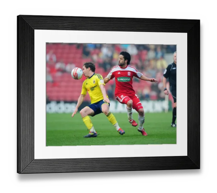 Framed Print : Neil Kilkenny vs. Merouane Zemmama: Battle for the Ball in Middlesbrough vs. Bristol City Football Match, March 2012