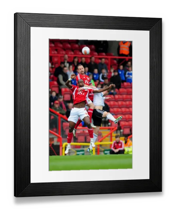 Framed Print : Bristol City vs Derby County: Intense Aerial Battle Between Louis Carey and Steve Davies Framed Print : Bristol City vs Derby County: Intense Aerial Battle Between Louis Carey and Steve Davies