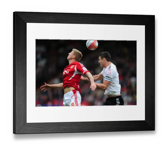 Framed Print : Battling for Supremacy: Jon Stead vs. Jason Shackell in the Derby County Clash at Ashton Gate, 2012
