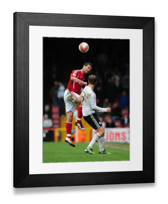 Framed Print : Bristol City's Jamie McAllister Wins the High Ball in Thrilling Derby County Match, Ashton Gate Stadium, 2012