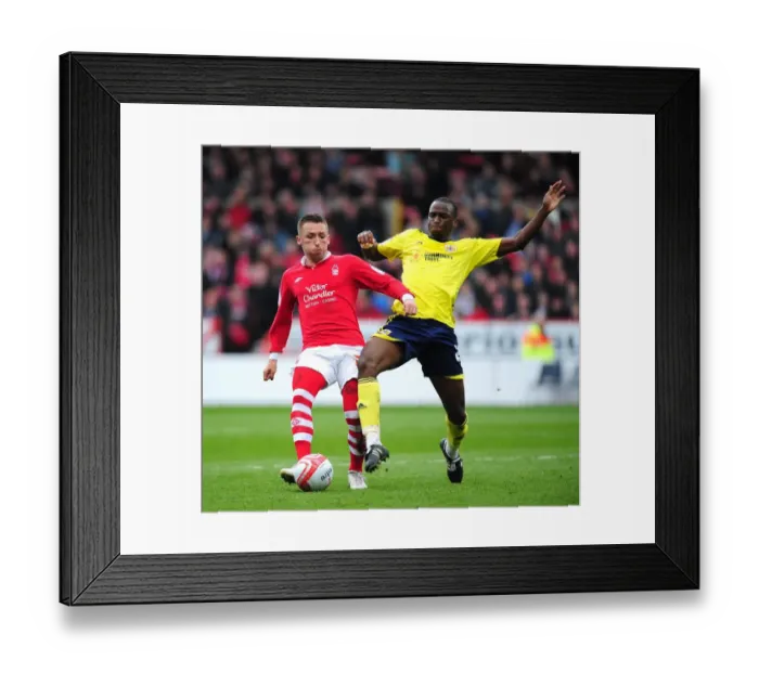 Framed Print : Bristol City's Kalifa Cisse vs. Nottingham Forest's Radoslaw Majewski: Battle for the Ball at The City Ground (Nottingham Forest v Bristol City, Football)