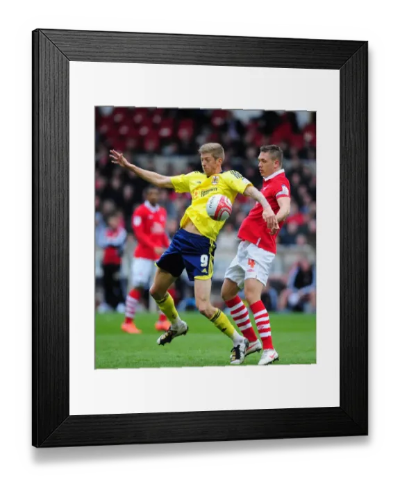 Framed Print : Battling for Supremacy: Jon Stead vs. Luke Chambers in Nottingham Forest vs. Bristol City Football Match, April 2012 Framed Print : Battling for Supremacy: Jon Stead vs. Luke Chambers in Nottingham Forest vs. Bristol City Football Match, April 2012