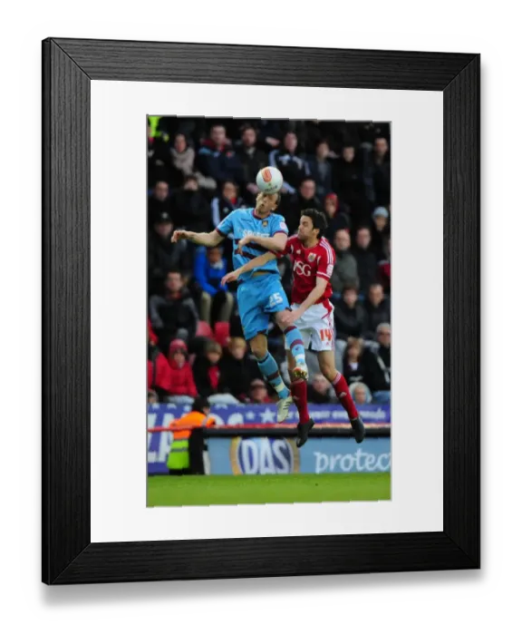 Framed Print : Bristol City vs. West Ham: Cole Skuse vs. Danny Collins Battle for High Ball at Ashton Gate Stadium
