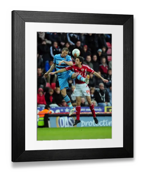 Framed Print : Bristol City vs. West Ham: A High Stakes Aerial Battle - Skuse vs. Collins Framed Print : Bristol City vs. West Ham: A High Stakes Aerial Battle - Skuse vs. Collins