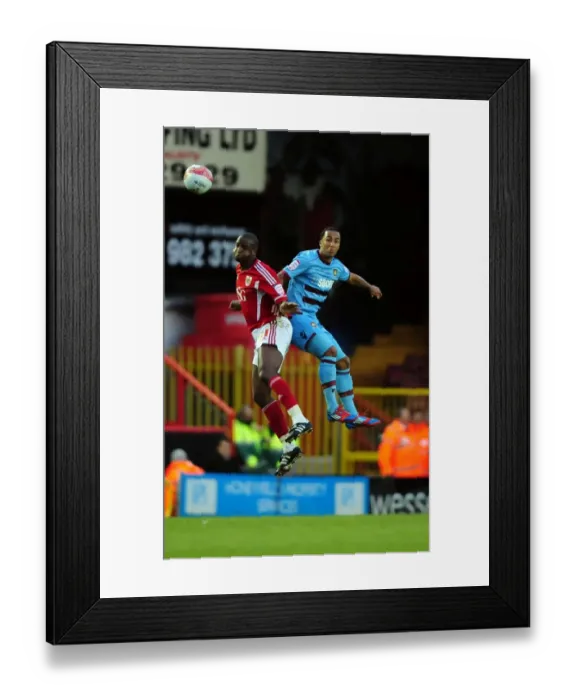 Framed Print : Bristol City vs. West Ham: Intense Aerial Battle Between Kalifa Cisse and Nicky Maynard Framed Print : Bristol City vs. West Ham: Intense Aerial Battle Between Kalifa Cisse and Nicky Maynard