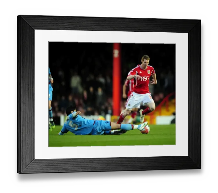 Framed Print : Bristol City vs. West Ham: Pearson vs. Tomkins Tackle Battle Framed Print : Bristol City vs. West Ham: Pearson vs. Tomkins Tackle Battle