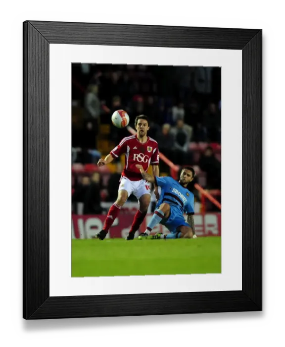 Framed Print : Battling Midfielders: Cole Skuse vs. Henri Lansbury in the Thrilling Bristol City vs. West Ham Clash at Ashton Gate Stadium (April 2012) Framed Print : Battling Midfielders: Cole Skuse vs. Henri Lansbury in the Thrilling Bristol City vs. West Ham Clash at Ashton Gate Stadium (April 2012)