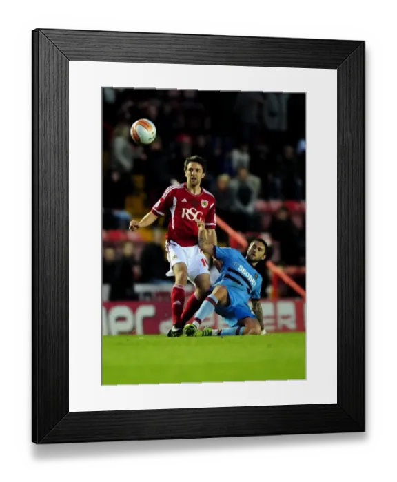 Framed Print : Battling Midfielders: Skuse vs. Lansbury at Ashton Gate, 2012 - A Football Rivalry Unfolds