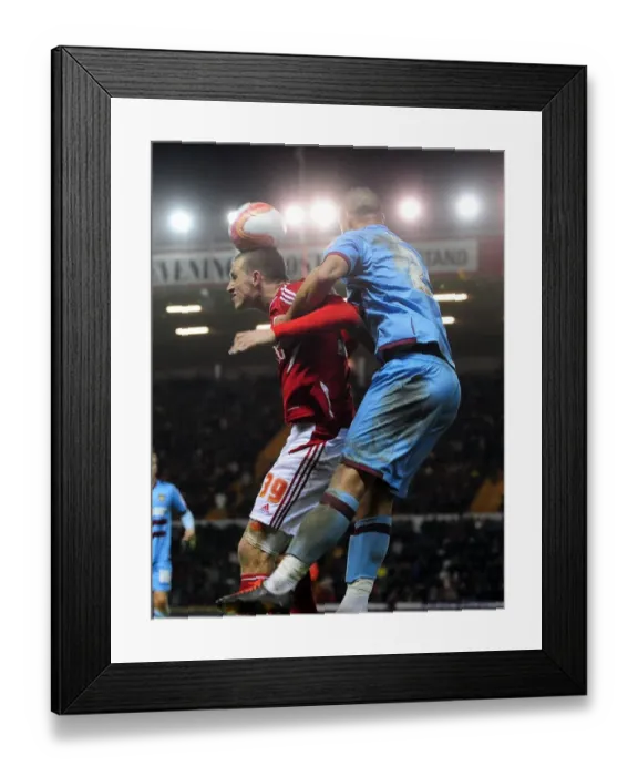 Framed Print : Chris Wood vs. Winston Reid: Aerial Battle at Ashton Gate Stadium - Bristol City vs. West Ham, 2012