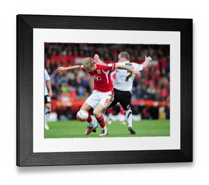 Framed Print : Intense Battle: Jon Stead vs Stephen Dawson - Bristol City vs Barnsley Football Match, Ashton Gate Stadium, 2012