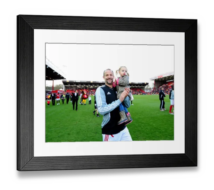 Framed Print : Bristol City's Louis Carey and Daughter Share Special Moment at Ashton Gate Stadium during Bristol City v Barnsley Match Framed Print : Bristol City's Louis Carey and Daughter Share Special Moment at Ashton Gate Stadium during Bristol City v Barnsley Match