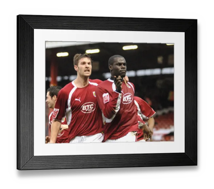 Framed Print : Bristol City's Enoch Showunmi and Jamie McCombe Clash in Action Against Barnsley