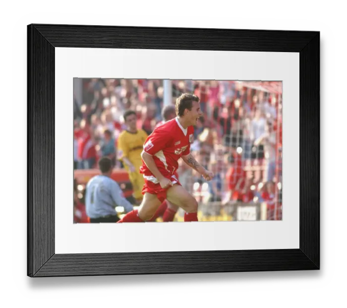Framed Print : Luke Wilkshire's Exuberant Goal Celebration (05-06 Season) Framed Print : Luke Wilkshire's Exuberant Goal Celebration (05-06 Season)