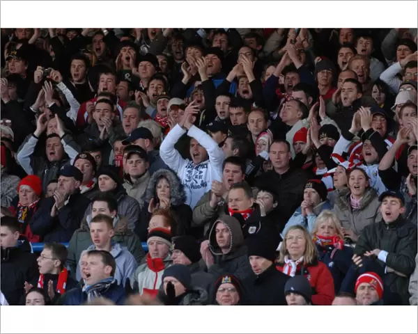 Fans. Bristol City fans singing during game away at Cardiff