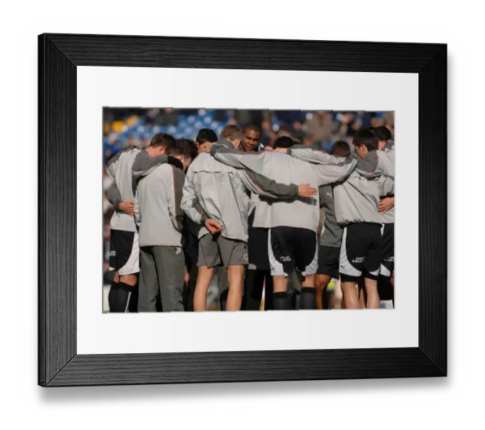 Framed Print : Gary Johnson gathers the team for a pre match huddle